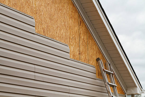 Professional Emergency Siding Repair technician working in Woodsfield, OH